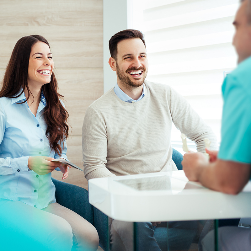 image of a couple playing with their dentist